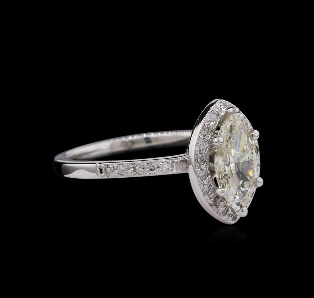 1.15 ctw Diamond Ring - 14KT White Gold: One electronically tested 14KT white gold lady's cast wedding ring with a halo with a bright polish finish. The featured lady's ring has a shank measuring 1.74 millimeters wide. Identified with markin