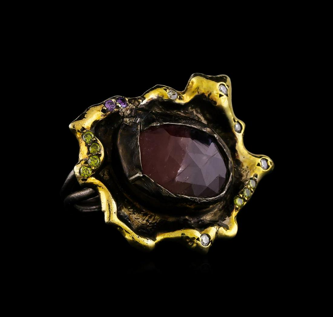 Sterling Silver Ring: One of a kind high fashion sterling silver Ring weighing 16 grams. Black Antique texture. Containing: Ruby, Purple Crystal, White Crystal, Yellowish Green Crystal. This sterling silver promises a last