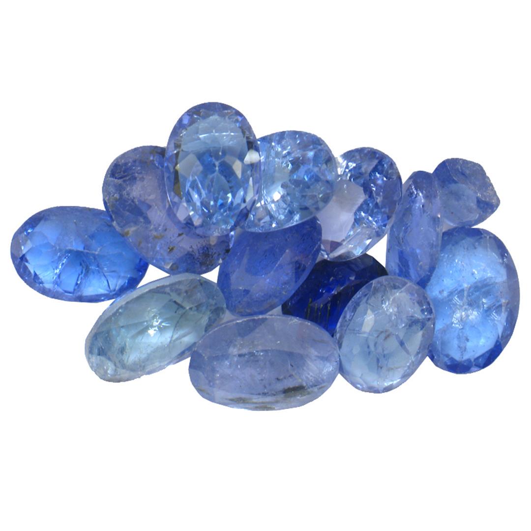 11.4 ctw Oval Mixed Tanzanite Parcel: Twelve oval mixed cut natural tanzanites exact total weight 11.40ct., clarity is moderately included, type I, medium dark, very slightly grayish, bluish violet color, (GIA bV 6/3), cut is good. Transm