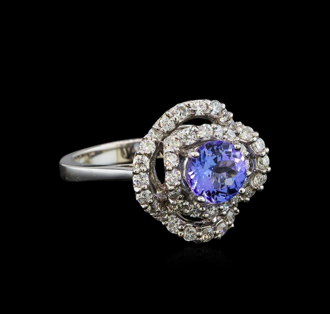 14KT White Gold 1.40 ctw Tanzanite and Diamond Ring: One electronically tested 14KT white gold ladies cast tanzanite and diamond ring with a bright polish finish. Identified with markings of "14K". Condition is new. Containing: One prong set round modif