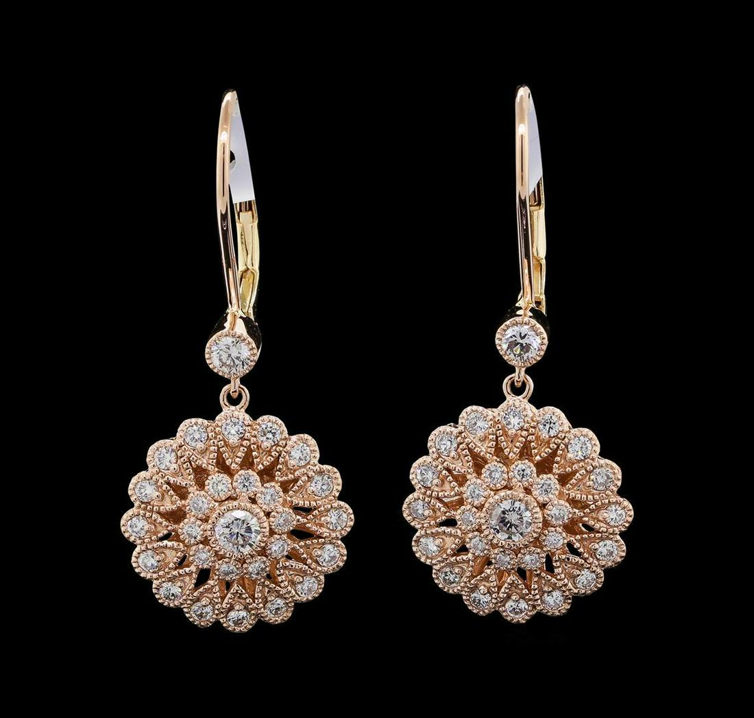 0.97 ctw Diamond Earrings - 14KT Yellow, White, and: One pair electronically tested 14KT yellow, white, and rose gold lady's combination cast & assembled starburst design dangle earrings with lever backs with a bright polish with milgrain detailing fini