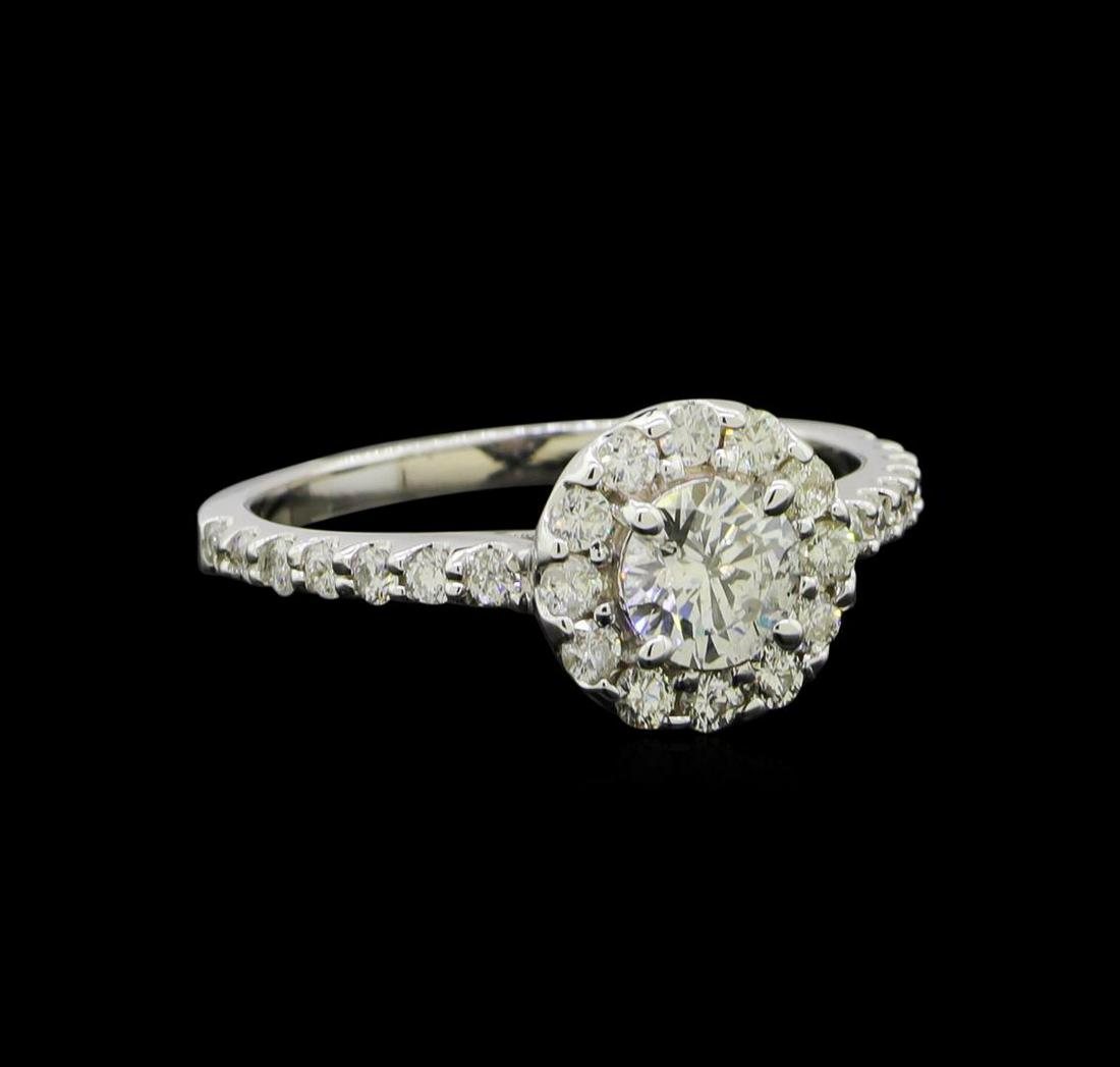 1.04 ctw Diamond Ring - 14KT White Gold: One electronically tested 14KT white gold lady's cast wedding ring with a halo with a bright polish finish. The featured lady's ring has a shank measuring 1.81 millimeters wide. Identified with markin