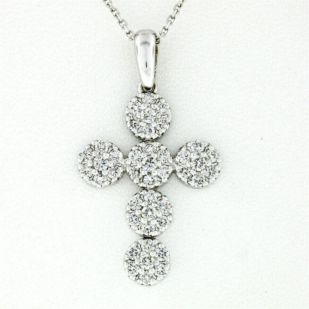 New 14kt White Gold 0.85 ctw Ideal Cut Diamond Multi: A new 14kt white gold cross pendant necklace featuring 42 round brilliant diamonds (E/F - VVS1/VVS2 ;0.85ctw) set in 6 round clusters. 18 inch cable link chain, 4.48 grams total weight, pendant measur