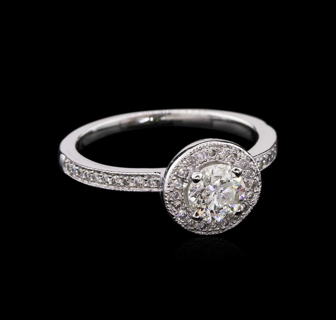 0.72 ctw Diamond Ring - 14KT White Gold: One electronically tested 14KT white gold lady's cast wedding ring with a halo with a bright polish with milgrain detailing finish. The featured lady's ring has a shank measuring 1.58 millimeters wide