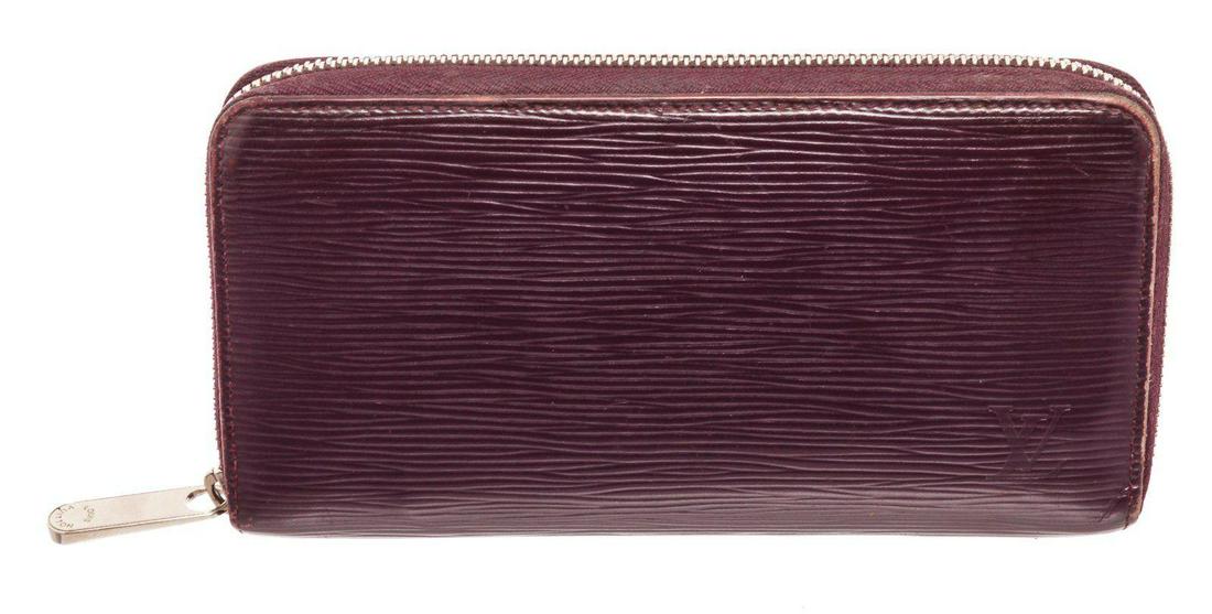 Louis Vuitton Cassis Epi Leather Zippy Wallet: Louis Vuitton Cassis Epi Leather Zippy Wallet with gold-tone hardware, onal leather interior, four interior compartments; one with zip closure, three interior bill compartments, eight card slots and z