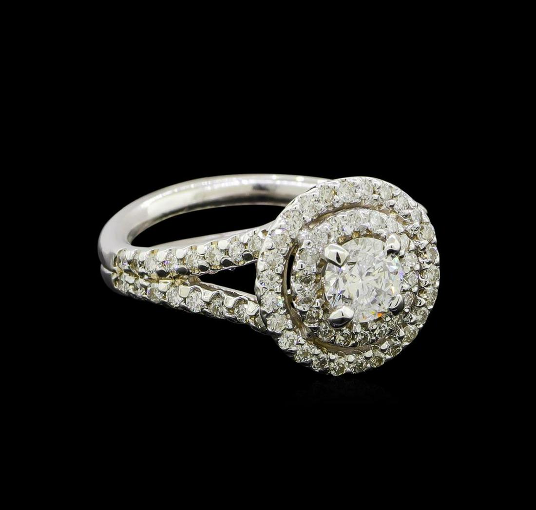 1.18 ctw Diamond Ring - 14KT White Gold: One electronically tested 14KT white gold lady's cast wedding ring with a split shank double basket halo with a bright polish finish. The featured lady's ring has a split double shank measuring 5.53 m