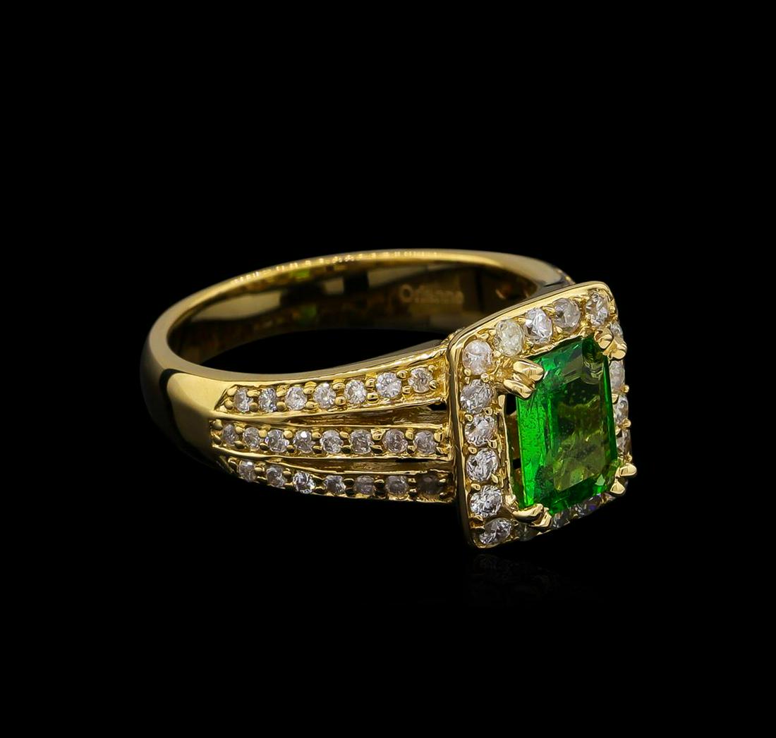 1.22 ctw Tsavorite and Diamond Ring - 14KT Yellow Gold: One electronically tested 14KT yellow gold lady's cast fashion ring with a three row split shank halo with a bright polish finish. The featured lady's ring has a shank measuring 3.54 millimeters wide.