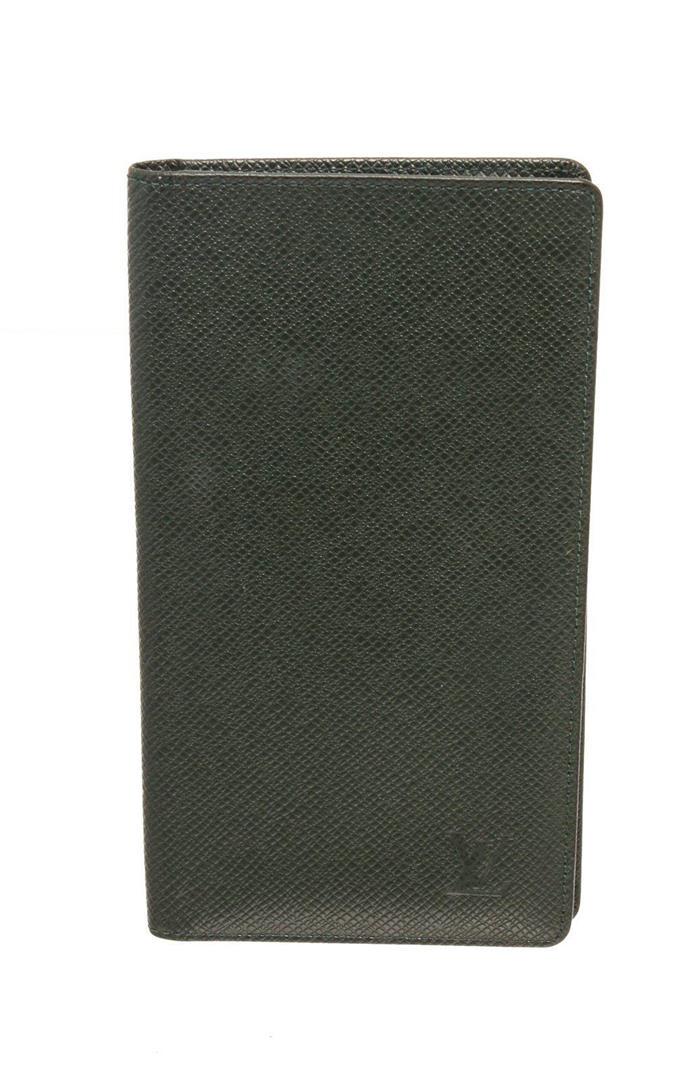 Louis Vuitton Green Taiga Leather Long Card Wallet: Louis Vuitton Green Taiga Leather Long Card Wallet with gold-tone hardware, any debossed logo embellishments, interior slip pockets, taiga leather lining, and bifold closure. Measurements: Length: 7.5