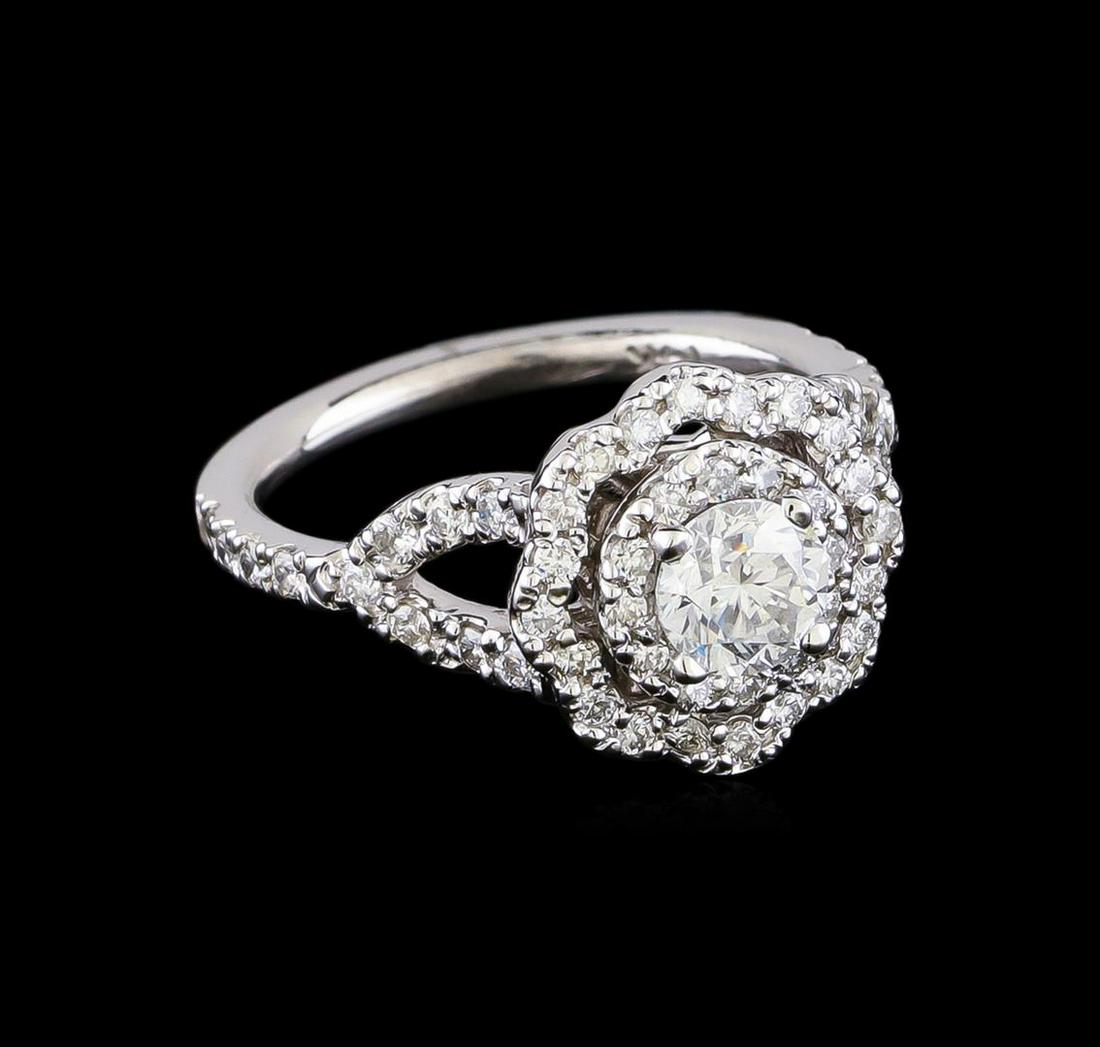 1.25 ctw Diamond Ring - 14KT White Gold: One electronically tested 14KT white gold lady's cast wedding ring with a split shank basket halo with a bright polish finish. The featured lady's ring has a shank measuring 1.76 millimeters in width.