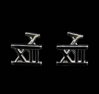 Tiffany & Co. 18KT White Gold Cuff Links: One pair electronically tested 18KT white gold gents cast cuff links. Each cuff link is from Tiffany & Co's Atlas Collection. Area measurements 22.0 x 13.0mm. Bright polish finish. Trademark is T &