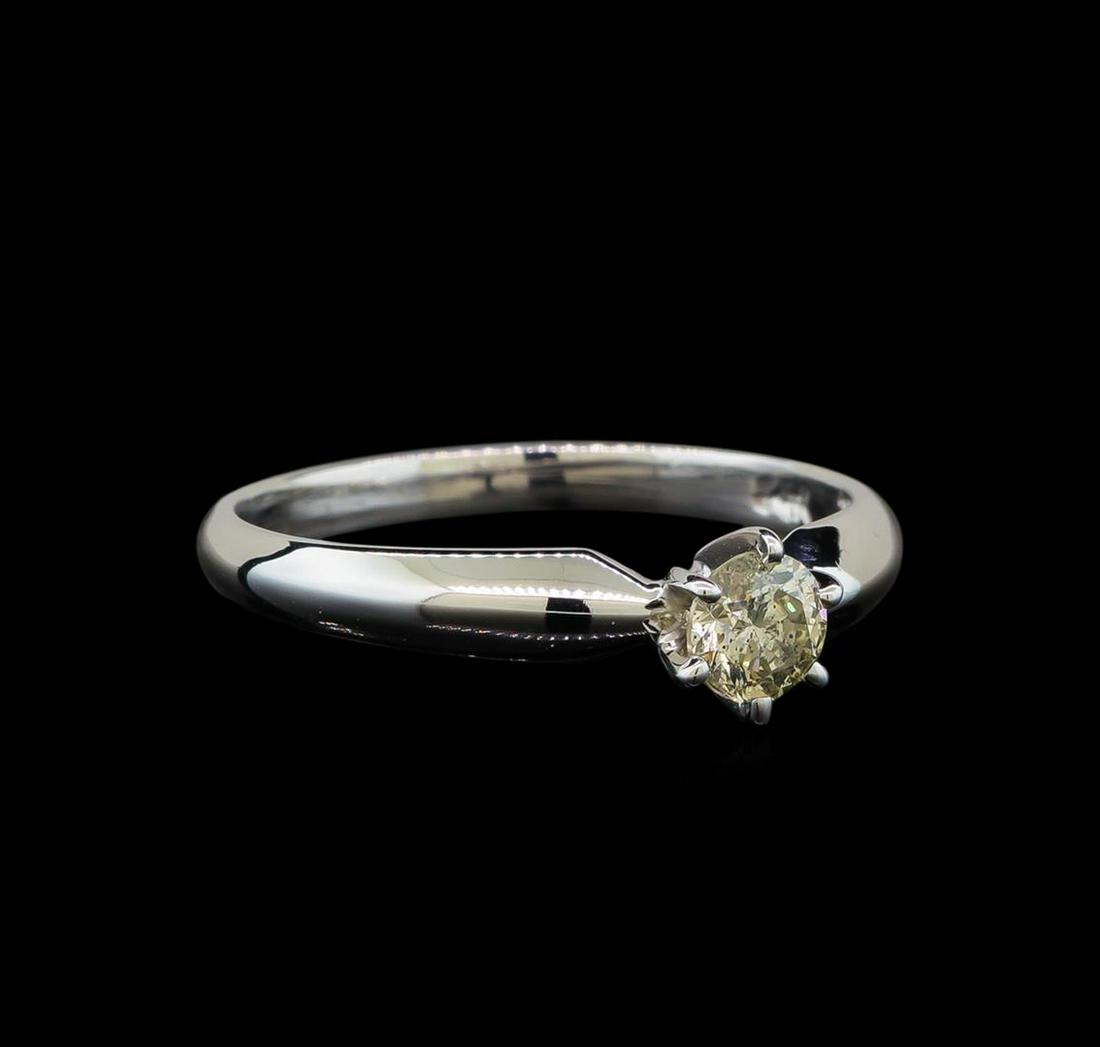 14KT White Gold 0.33 ctw Round Cut Diamond Solitaire: One electronically tested 14KT white gold ladies cast diamond solitaire ring with a half round shank with a bright polish finish. Identified with markings of "14K". Condition is new. Containing: One p
