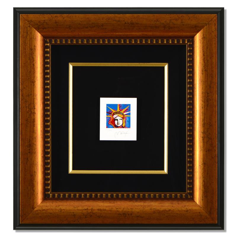 Liberty Head I by Peter Max: Liberty Head I by Peter Max. "Liberty Head I" is a limited edition lithograph on paper by Peter Max, numbered 447/500 and hand signed by the artist. This piece comes framed. Includes Certificate of Au