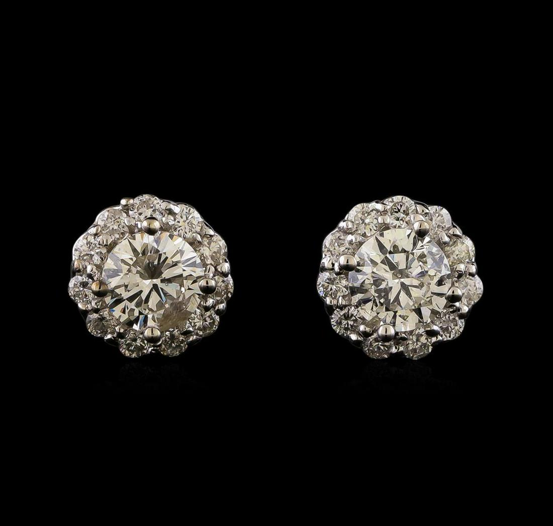 1.41 ctw Diamond Earrings - 14KT White Gold: One pair electronically tested 14KT white gold lady's cast stud earrings with friction posts with a basket halo with a bright polish finish. Identified with markings of '14K'. Condition is new, good w