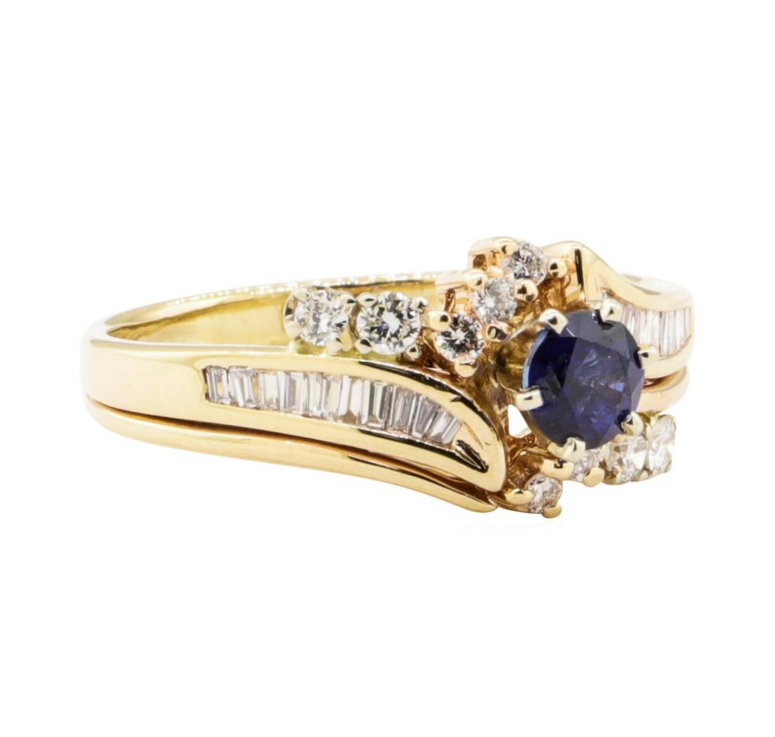 1.10 ctw Blue Sapphire and Diamond Ring - 14KT Yellow: One band soldered to a ring featuring: 14KT yellow gold weighing 5.1 grams containing one sapphire weighing 0.60 ct and diamonds weighing 0.50 ctw.