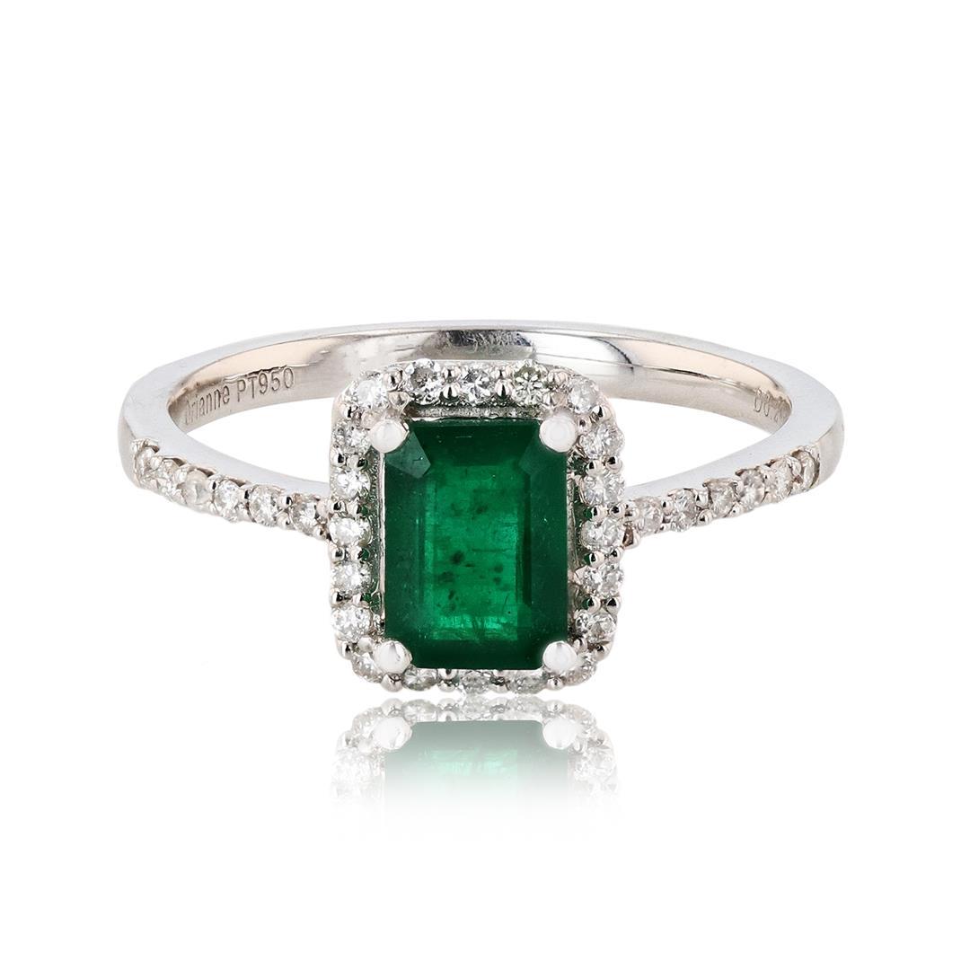 1.07 ctw Emerald and 0.26 ctw Diamond Platinum Ring: One Platinum Emerald and Diamond ring weighing approx. 3.20 grams. Containing: One Green (GIA G 5/4) hue, medium tone, moderately strong saturation, Type III, Emerald cut Emerald weighing approx. 1.07
