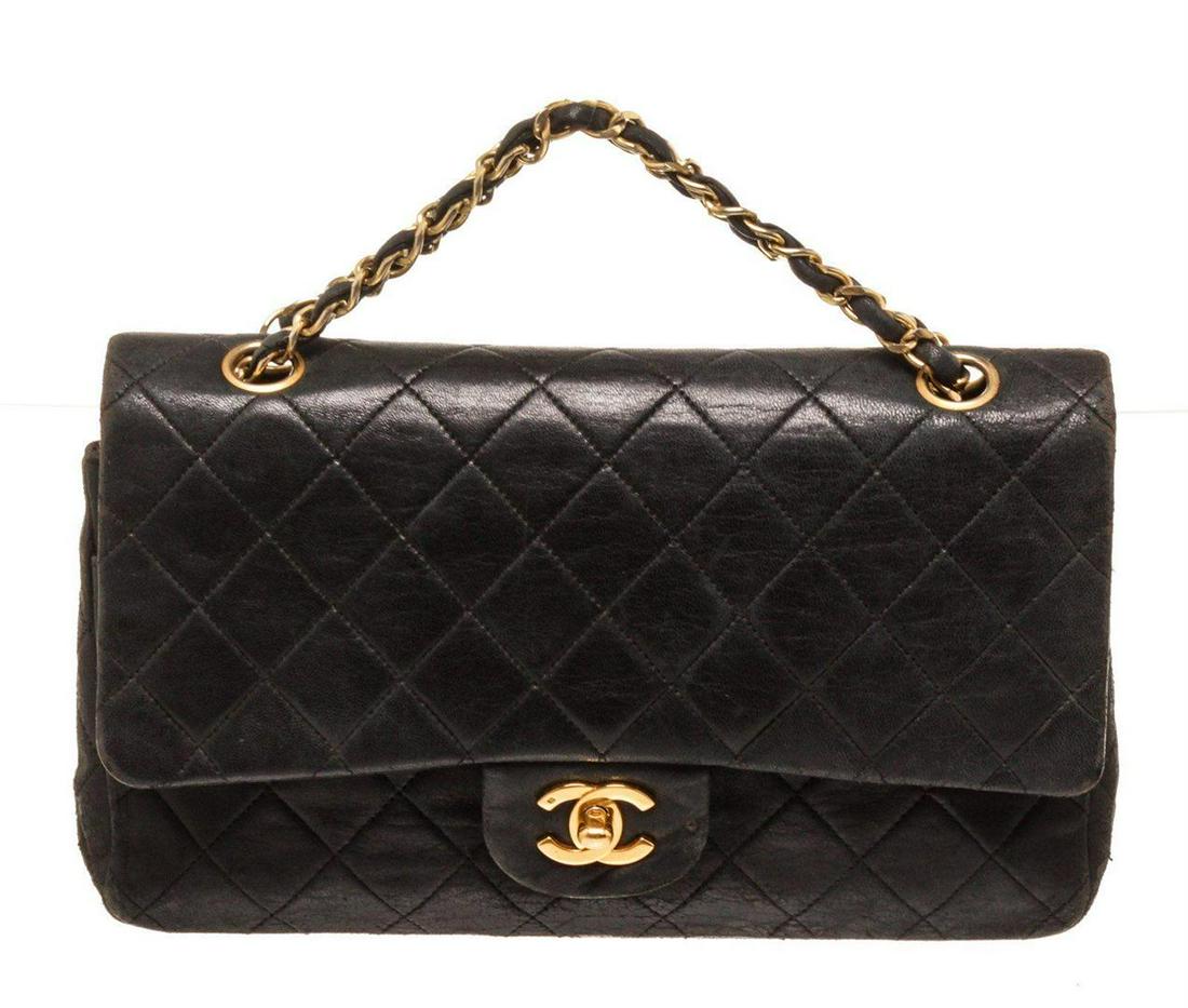 Chanel Black Lambskin Flap Shoulder Bag: Chanel Black Lambskin Flap Shoulder Bag. Chanel Black Lambskin Flap Shoulder Bag with material leather, gold-tone hardware, interior slip pockets, chain shoulder strap and flap closure.