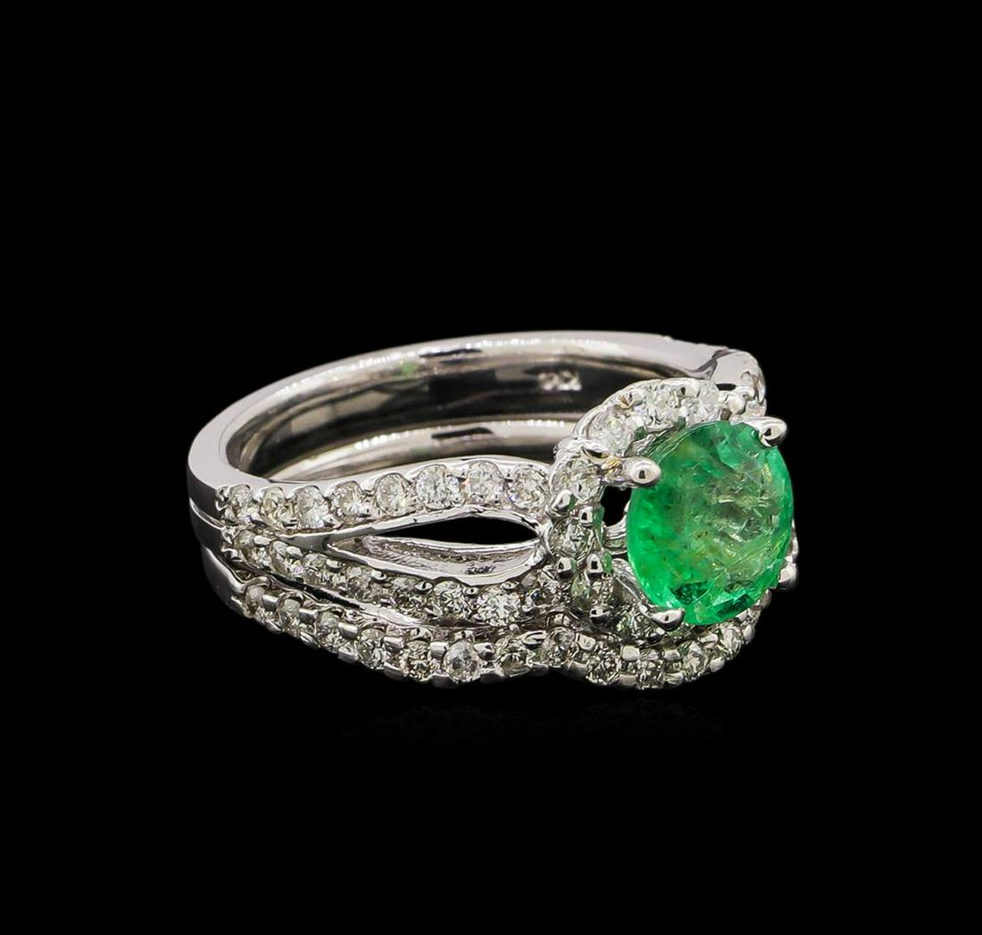 14KT White Gold 1.43 ctw Emerald and Diamond Wedding: One electronically tested 14KT white gold ladies cast emerald and diamond engagement ring & wedding band with a bright polish finish. Identified with markings of "K14". Condition is new. Containing: O