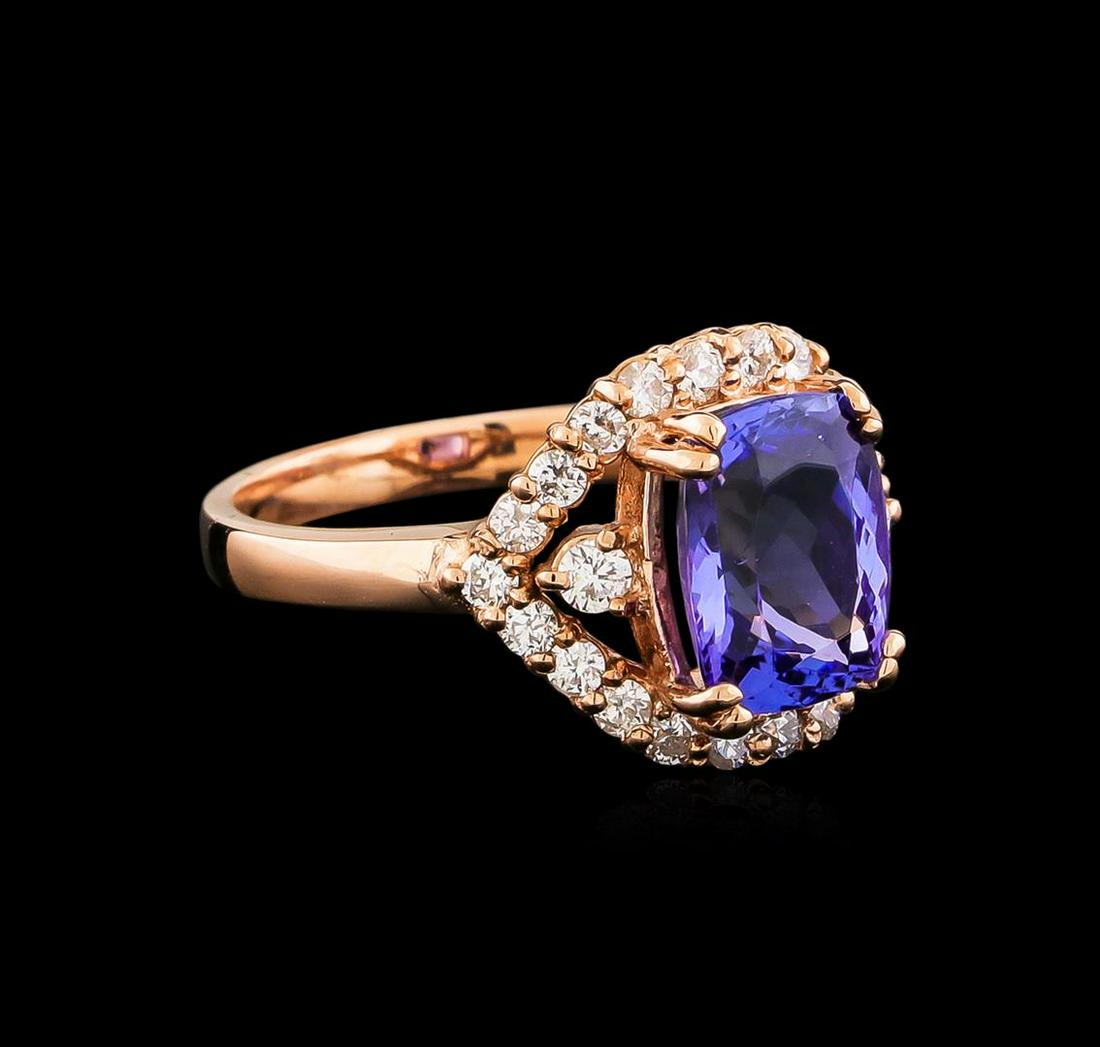 14KT Rose Gold 2.95 ctw Tanzanite and Diamond Ring: One electronically tested 14KT rose gold ladies combination cast & assembled ring with a bright polish finish. Condition is new. Identified with markings of "K14". Containing: Twenty-Four prong set ro