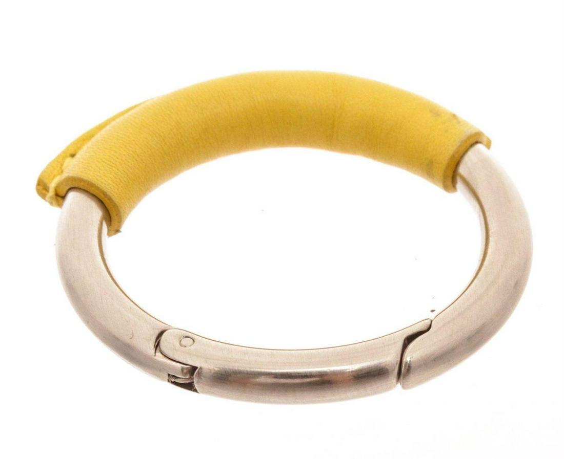 Salvatore Ferragamo Silver Yellow Key Ring: Salvatore Ferragamo Silver Yellow Key Ring. Salvatore Ferragamo Silver Yellow Key Ring with gold-tone hardware MEASUREMENTS: Length 1 in / 3 cm Width 1 in / 3 cm Height 1 in / 3 cmCONDITION: Pre-Owned