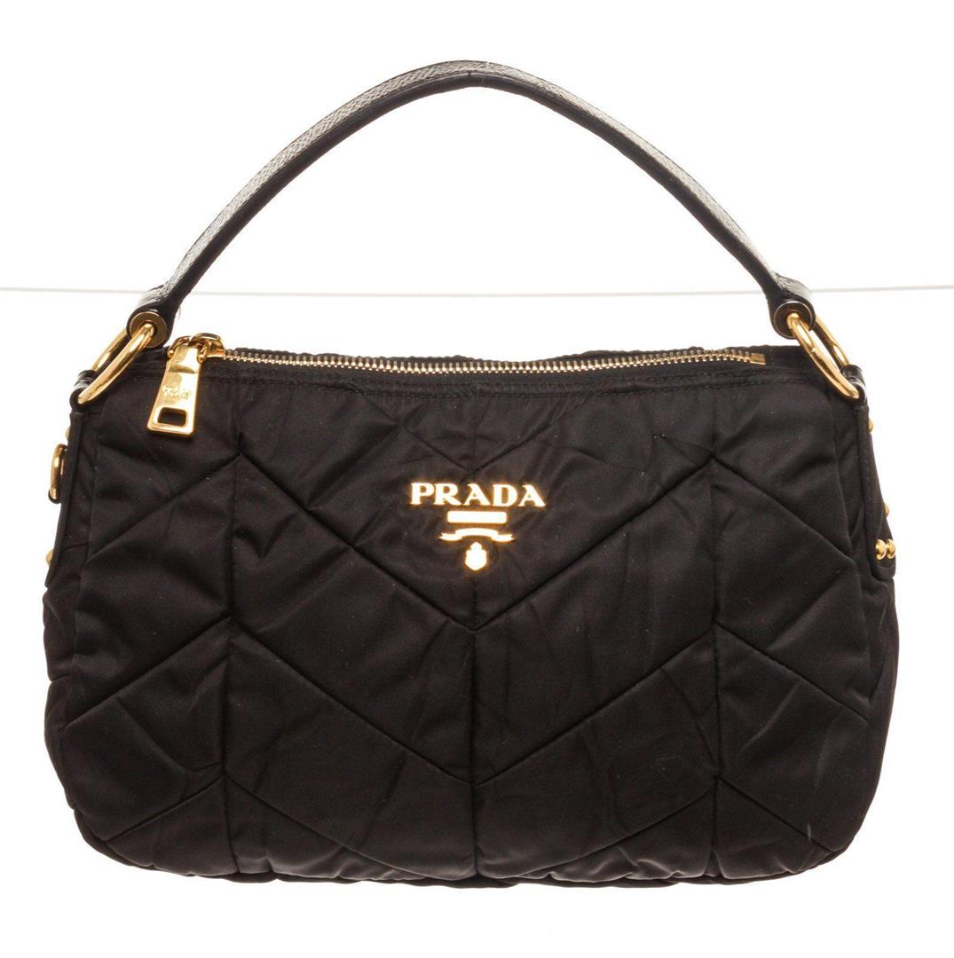 Prada Black Quilted Handbag: Prada Black Quilted Handbag. Prada Black Quilted Handbag with material leather, gold-tone hardware, trim leather, interior slip pocket, shoulder strap and zipper closure.