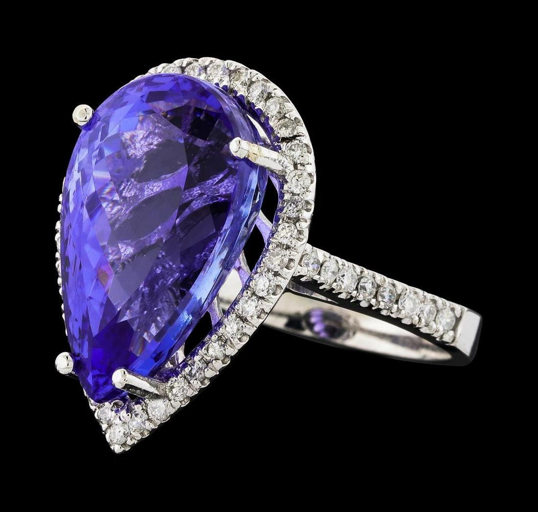 GIA Cert 14.31 ctw Tanzanite and Diamond Ring - 14KT: One electronically tested 14KT white gold lady's cast fashion ring with a cathedral shank with a basket halo with a bright polish finish. The featured lady's ring has a shank measuring 2.49 millimeter