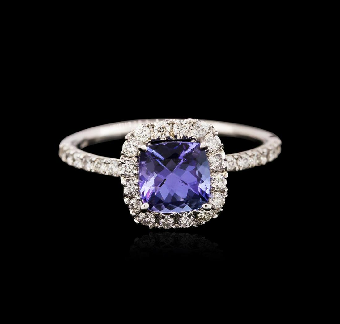 14KT White Gold 1.36 ctw Tanzanite and Diamond Ring: One electronically tested 14KT white gold ladies cast tanzanite and diamond ring with a bright polish finish. Identified with markings of "14K". Condition is new. Containing: One prong set square cush