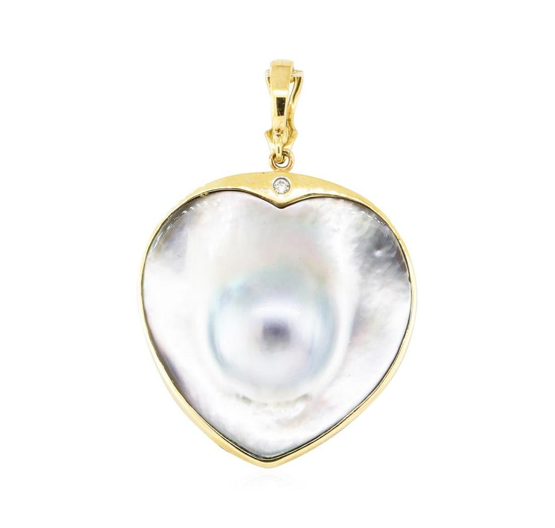 0.03 ctw Diamond and Black Mother of Pearl Heart Shaped: One heart shaped pendant enhancer featuring: 14KT yellow gold weighing 9.6 grams containing one piece of heart shaped black mother of pearl and one diamond weighing 0.03ct.