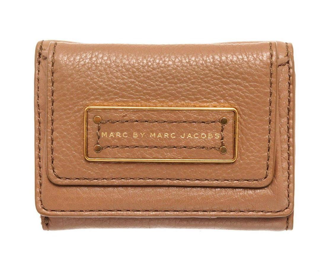 Marc By Marc Jacobs Brown Leather Mini Compact Flap: Marc By Marc Jacobs brown leather mini compact flap wallet with gold-tone hardware, logo placard at front, pouch pocket at front face with snap closure, brown leather interior lining, three card slots