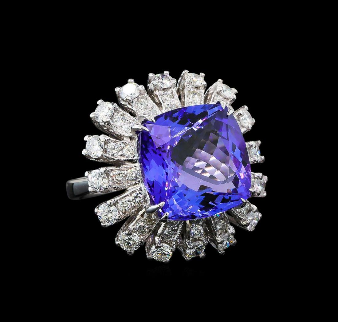 GIA Cert 11.86 ctw Tanzanite and Diamond Ring - 14KT: One electronically tested 14KT white gold lady's cast starburst design ring with a triple basket halo with a bright polish with milgrain detailing finish. The featured lady's ring has a shank measurin