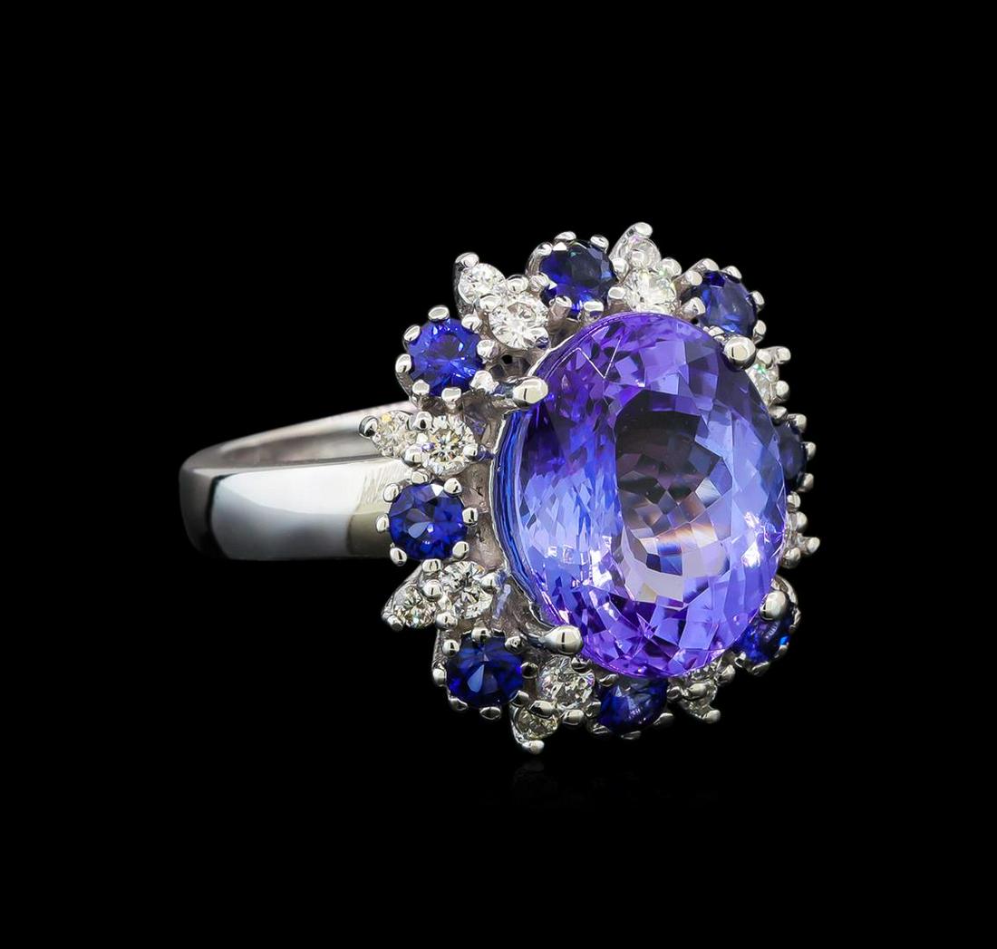 14KT White Gold 6.56 ctw Tanzanite, Sapphire and: One electronically tested 14KT white gold ladies cast tanzanite, sapphire and diamond ring with a bright polish finish. Identified with markings of "K14". Condition is new. Containing: One prong set o
