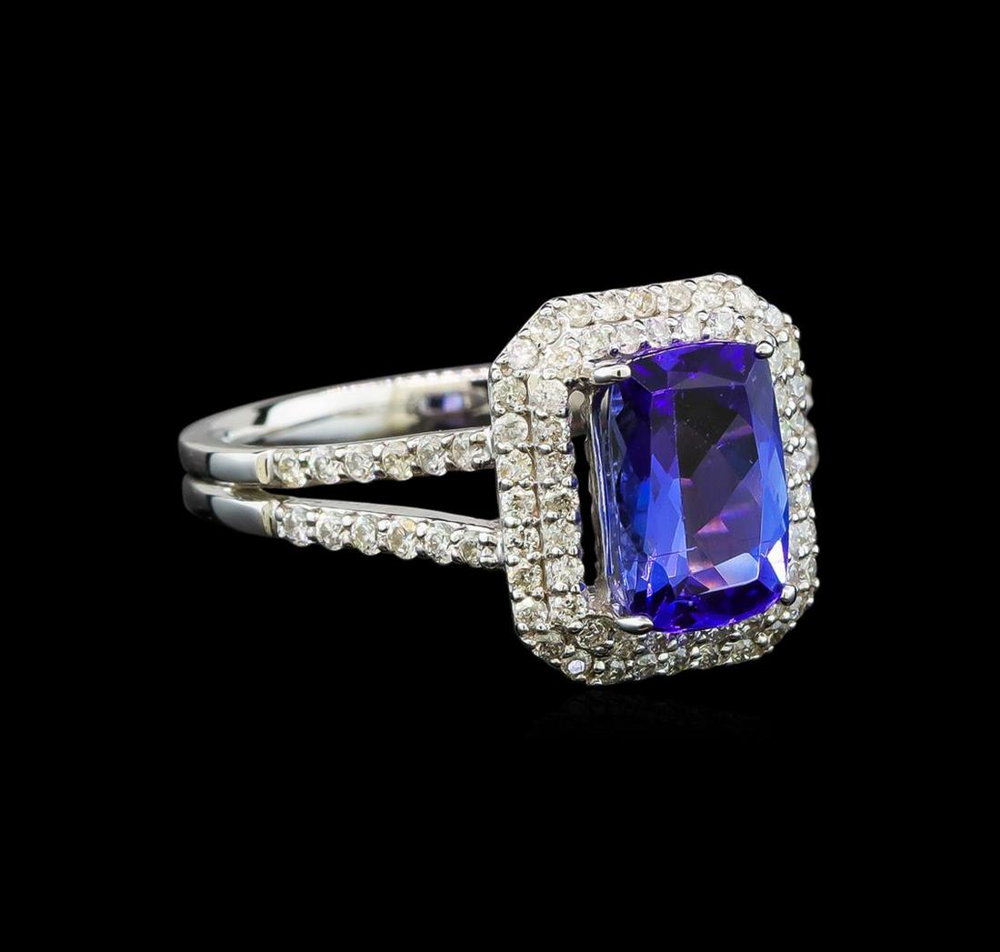 14KT White Gold 1.76 ctw Tanzanite and Diamond Ring: One electronically tested 14KT white gold ladies cast tanzanite and diamond ring with a bright polish finish. Identified with markings of "14K". Condition is new. Containing: One prong set rectangular