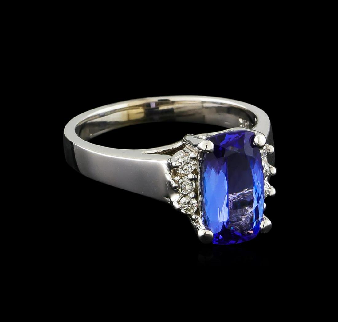 2.57 ctw Tanzanite and Diamond Ring - 14KT White Gold: One Ring featuring: 14KT White Gold weighing 5.57 grams containing one Tanzanite center stone with a total weight of 2.57ct and Diamonds with a total weight of 0.15ct.