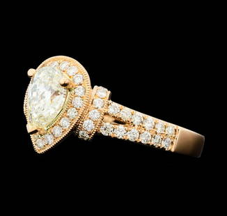 1.73 ctw Diamond Ring - 14KT Rose Gold: One electronically tested 14KT rose gold lady's cast wedding ring with a split cathedral shank with a halo with a bright polish with milgrain detailing finish. The featured lady's ring has a shank