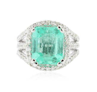 14KT White Gold 5.58 ctw Emerald and Diamond Ring: New Condition! MK9714NG. One electronically tested 14KT white gold ladies cast emerald and diamond ring with a bright polish finish. Condition is new, good workmanship. The featured emerald I set