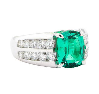 4.25 ctw Lab Created Emerald And Diamond Ring - 18KT White Gold: One electronically tested 18KT white gold lady's cast fashion ring with a double row cathedral shank with a bright polish finish. The featured lady's ring has a shank measuring 4.15 millimeters wide.