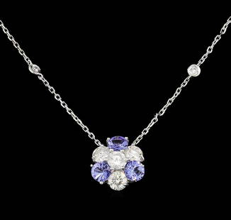 14KT White Gold 1.44 ctw Tanzanite and Diamond Necklace: One electronically tested 14KT white gold ladies cast tanzanite and diamond necklace with a lobster claw clasp with a bright polish finish. Measurements: 16" in length Identified with markings of