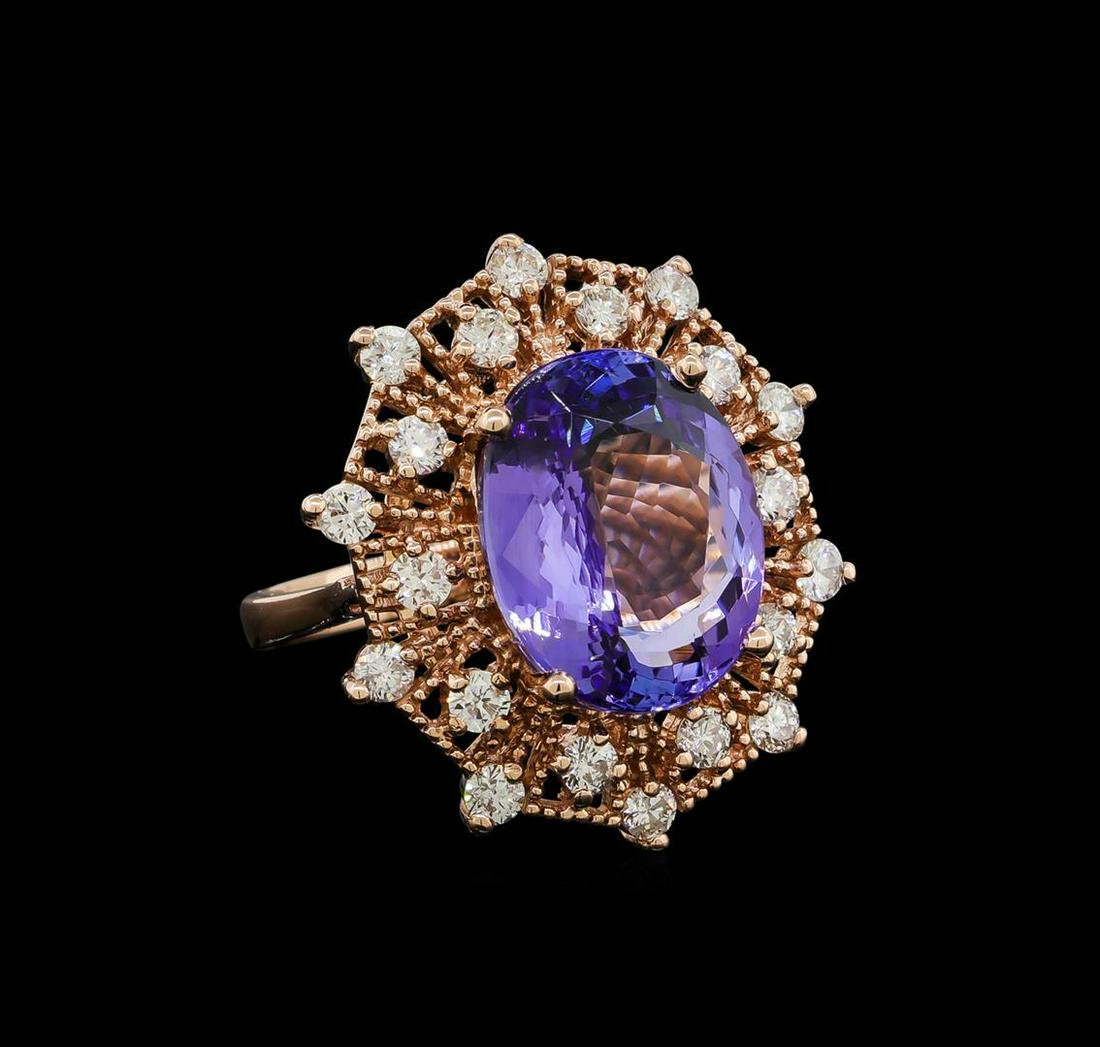 10.16 ctw Tanzanite and Diamond Ring - 14KT Rose Gold: One electronically tested 14KT rose gold lady's cast fashion ring with a double basket halo with a bright polish with milgrain detailing finish. The featured lady's ring has a shank measuring 2.76 mil