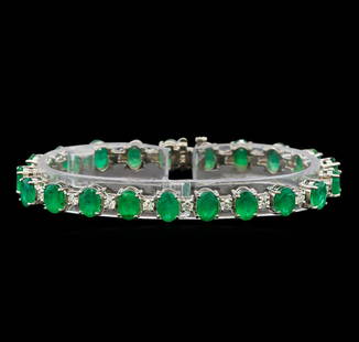 14KT White Gold 15.83 ctw Emerald and Diamond Bracelet: One electronically tested 14KT white gold ladies cast emerald and diamond bracelet with a hidden box clasp with a bright polish finish. Measurements: 7 inches in length. Identified with markings of