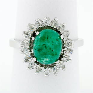 Vintage 14k White Gold 2.89 ctw Oval Cabochon Emerald Diamond Halo Flower Ring: A vintage solid 14k white gold halo flower ring with 1 oval cut natural emerald (9.36x7.60mm; 2.29ct) surrounded by 16 natural diamonds (G/H - SI1/SI2; 0.60ctw). The ring is size 8.0, weighs a total