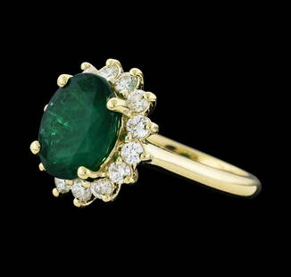 3.40 ctw Emerald and Diamond Ring - 14KT Yellow Gold: One electronically tested 14KT yellow gold lady's cast fashion ring with a basket halo with a bright polish finish. The featured lady's ring has a shank measuring 2.09 millimeters wide. Identified