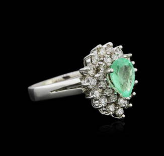 14KT White Gold 1.39 ctw Emerald and Diamond Ring: One electronically tested 14KT white gold ladies cast emerald and diamond ring with a split shoulder shank with a bright polish finish. Identified with markings of "K14". Condition is new.