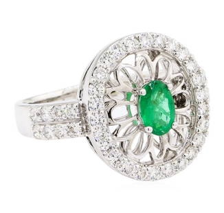 1.16 ctw Oval Mixed Emerald And Round Brilliant Cut Diamond Ring - 14KT White Go: One electronically tested 14KT white gold lady's cast fashion ring with a double shank with a halo with a bright polish finish. The featured lady's ring has a shank measuring 2.38 millimeters wide.