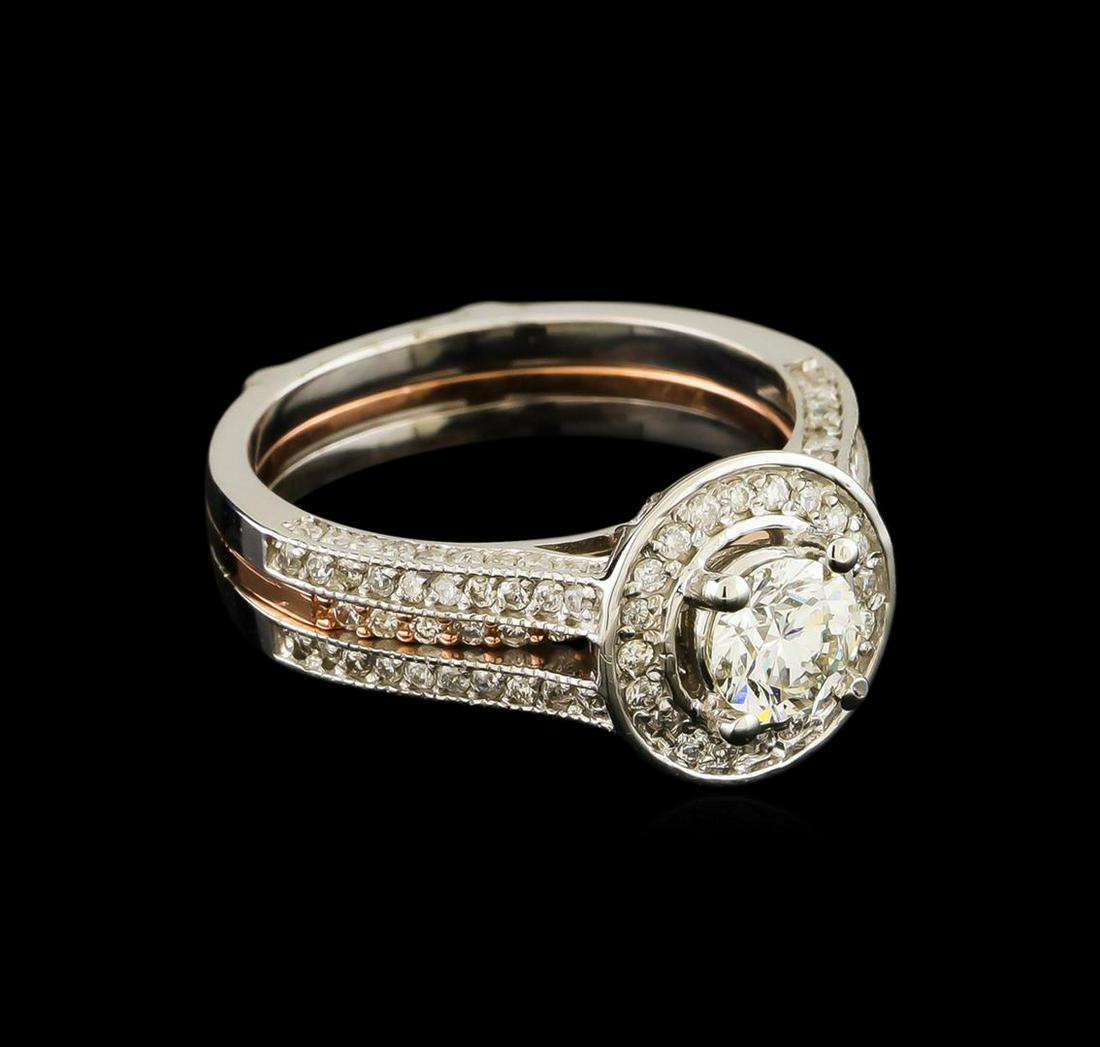 1.28 ctw Diamond Wedding Ring Set - 14KT Rose and White Gold: One set electronically tested 14KT rose and white gold lady's cast wedding ring & wedding band with a bright polish with milgrain detailing finish. The featured lady's wedding set has a triple shank m