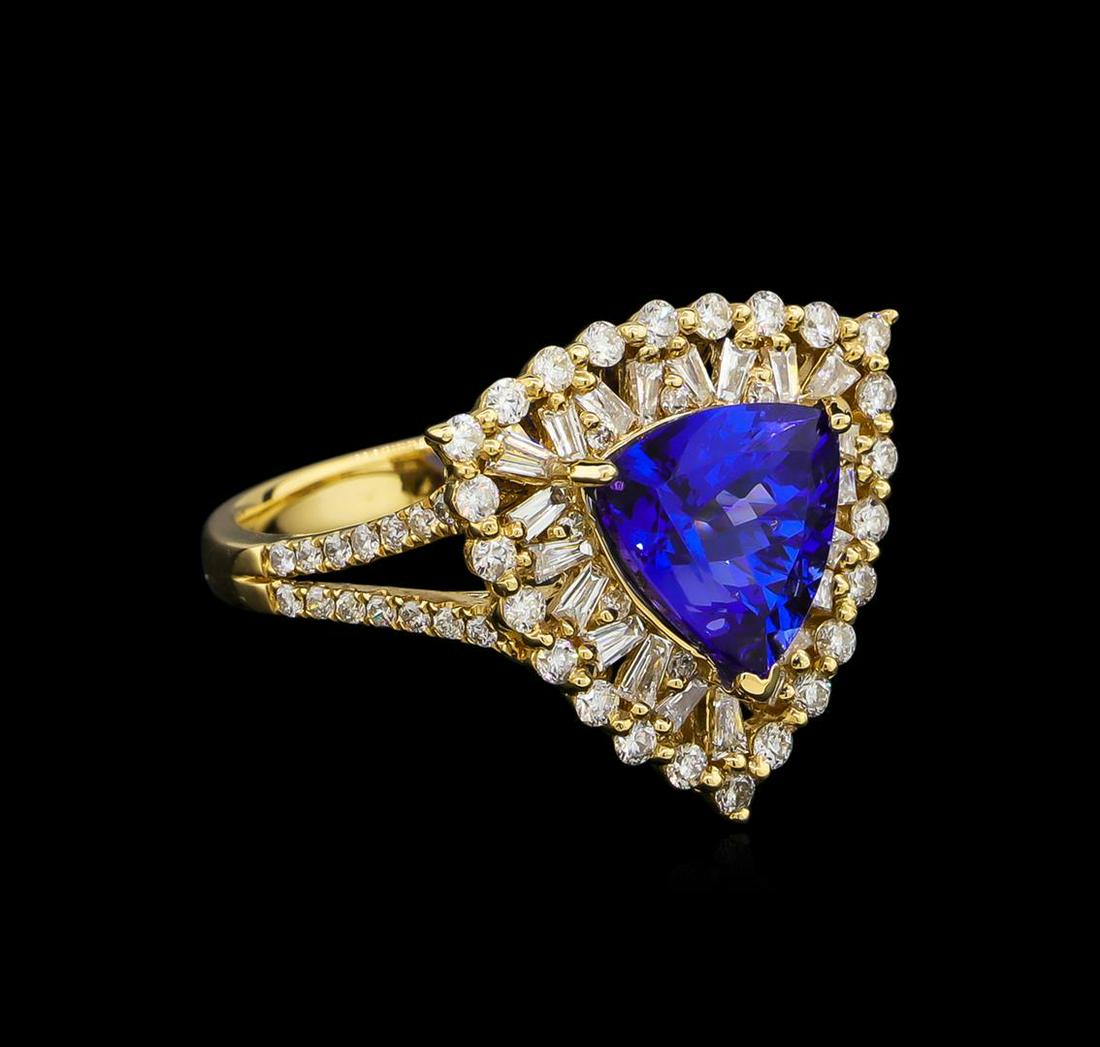14KT Yellow Gold 2.86 ctw Tanzanite and Diamond Ring: One electronically tested 14KT yellow gold Ladies combination cast & assembled ring with a bright polish finish. Identified with markings of "14K". Condition is new. Containing: Thirty-Seven prong set