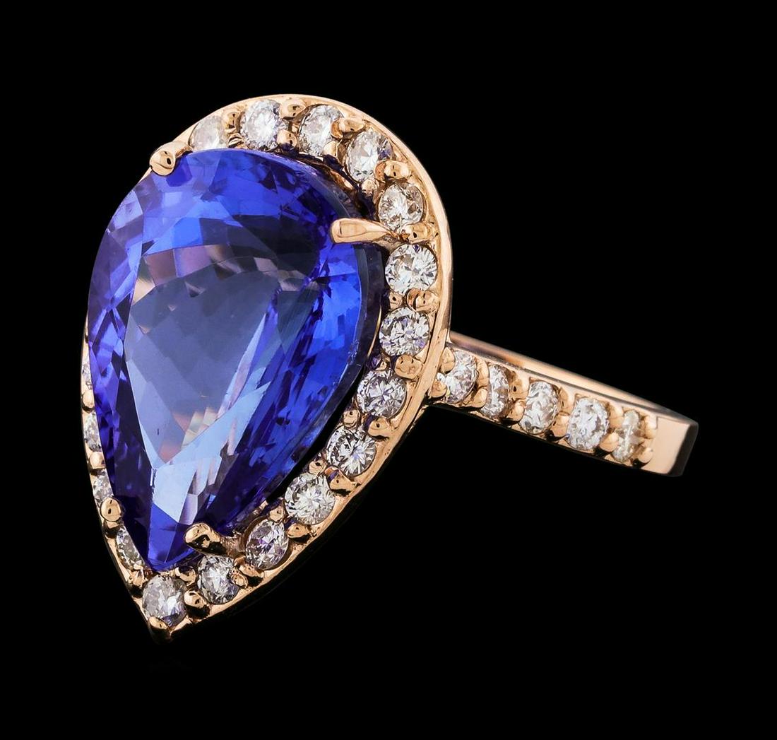 GIA Cert 8.88 ctw Tanzanite and Diamond Ring - 14KT Rose Gold: One electronically tested 14KT rose gold lady's cast fashion ring with a basket halo with a bright polish finish. The featured lady's ring has a shank measuring 2.08 millimeters wide. Identified with 