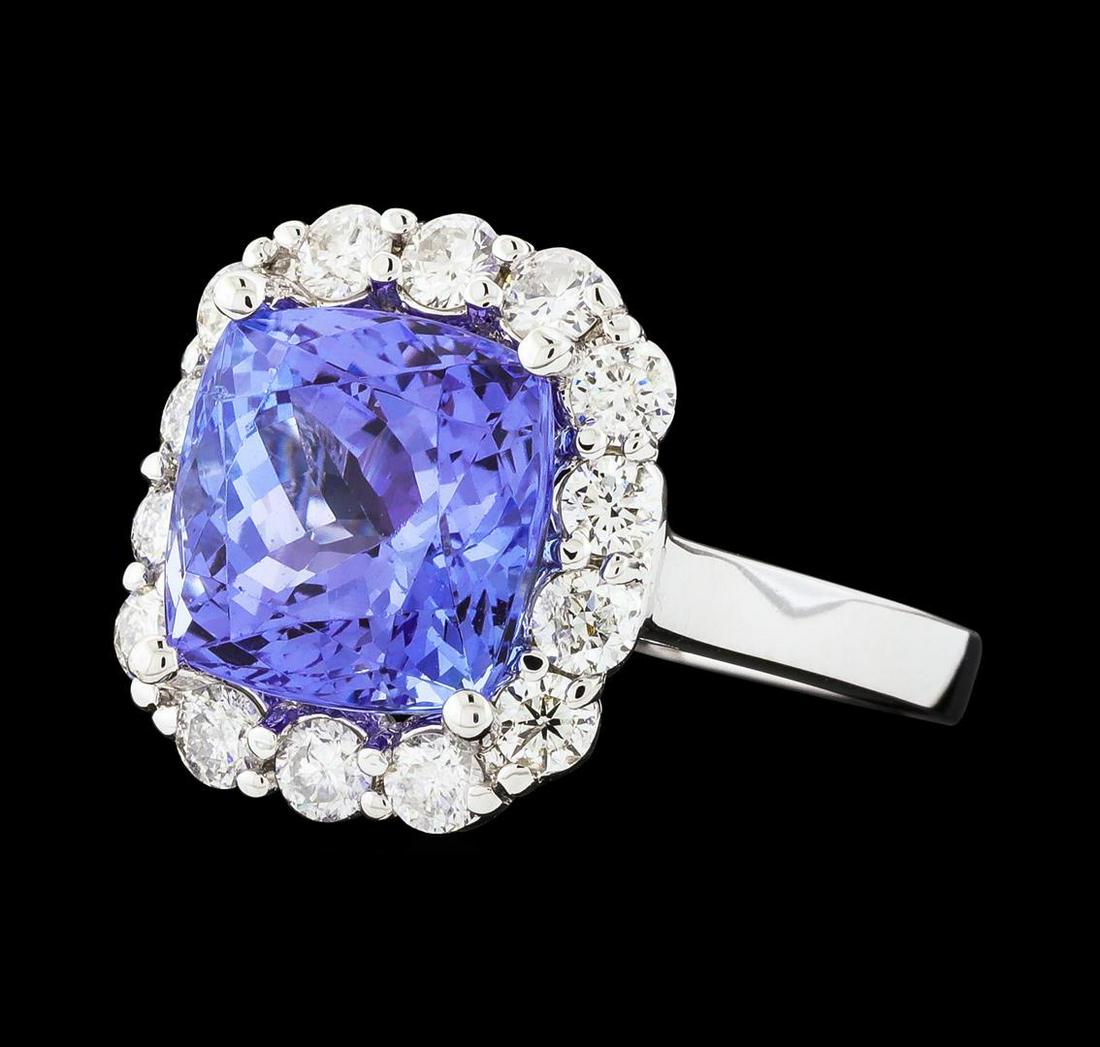 4.96 ctw Tanzanite and Diamond Ring - 14KT White Gold: One electronically tested 14KT white gold lady's cast fashion ring with a cathedral shank with a basket halo with a bright polish finish. The featured lady's ring has a shank measuring 2.04 millimeter