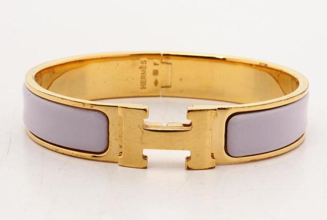 Hermes Purple Metal Clic Clac Bangle Bracelet GHW: Purple metal Hermes Clic Clac bangle with gold-tone hardware and CC turn-lock closure.