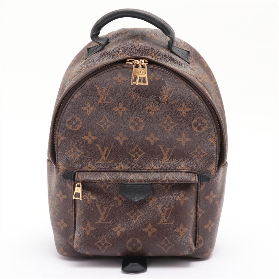 Louis Vuitton Brown Monogram Canvas Palm Springs PM Backpack: Brown and tan Monogram coated canvas Louis Vuitton Palm Springs PM backpack with gold-tone hardware, black leather trim, black nylon lining, interior slip pocket, exterior zipped pocket, padded adjust