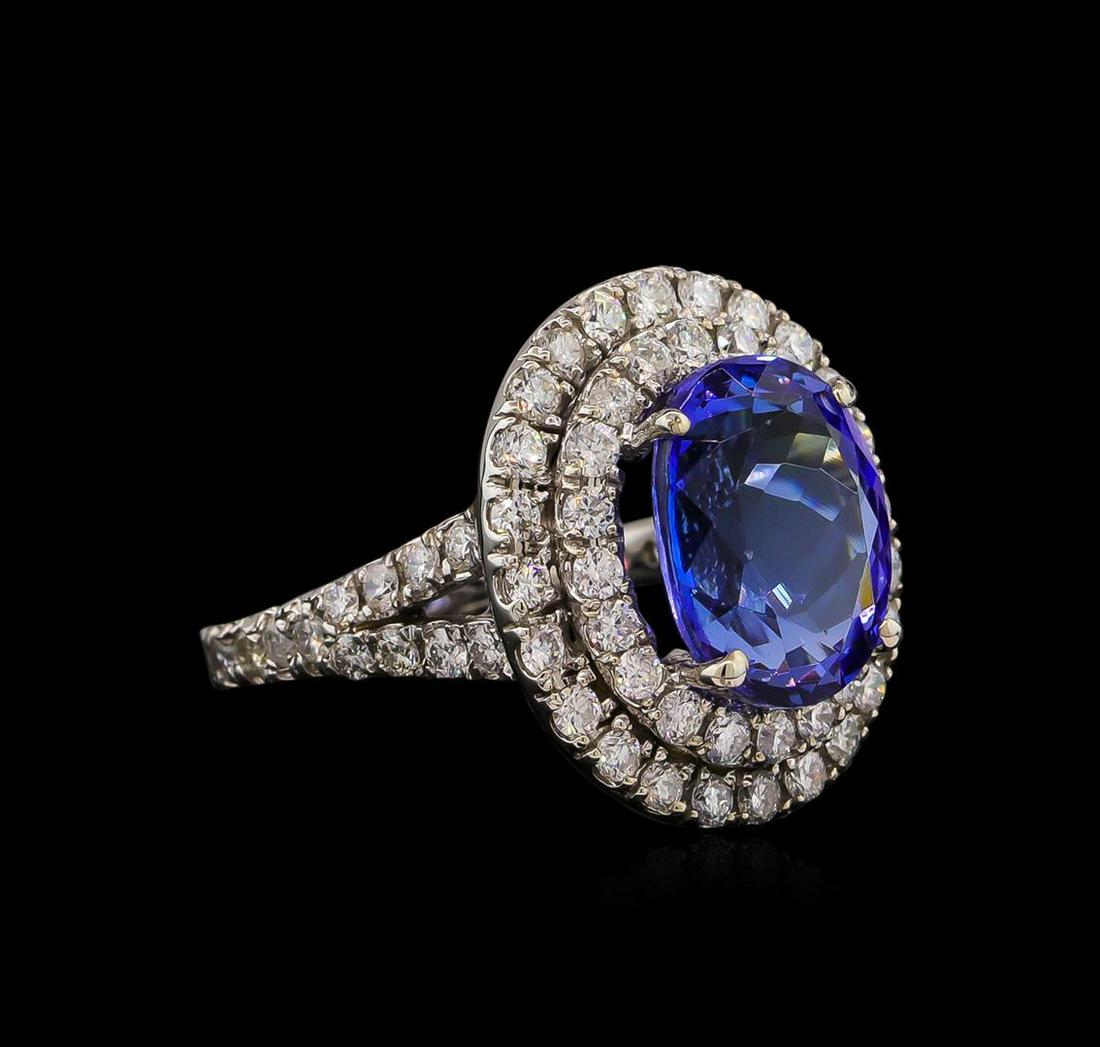 14KT White Gold 5.56 ctw Tanzanite and Diamond Ring: One electronically tested 14KT white gold Ladies combination cast & assembled ring with a bright polish finish. Condition is new. Identified with markings of "14K". Containing: One prong set oval modi