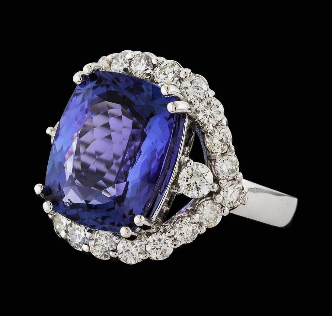 9.88 ctw Tanzanite and Diamond Ring - 14KT White Gold: One electronically tested 14KT white gold lady's cast fashion ring with a split shank halo with a bright polish finish. The featured lady's ring has a shank measuring 2.90 millimeters wide. Identified